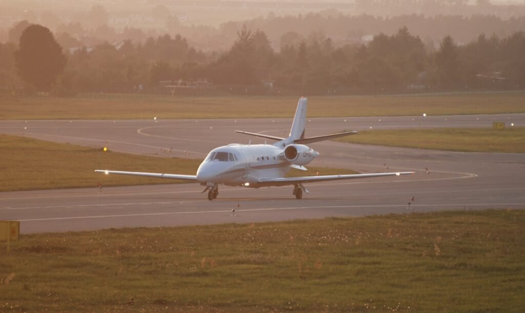 Light jet on tarmac at sunset