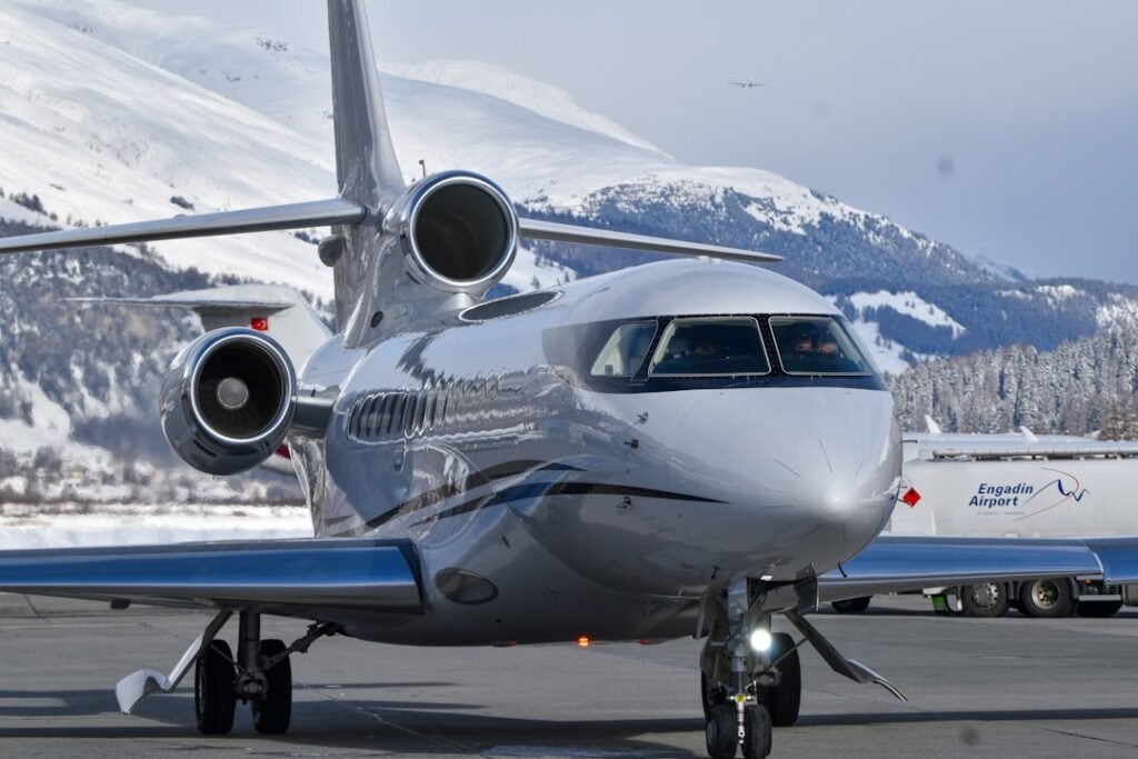 Midsize private jet on runway in the Alps