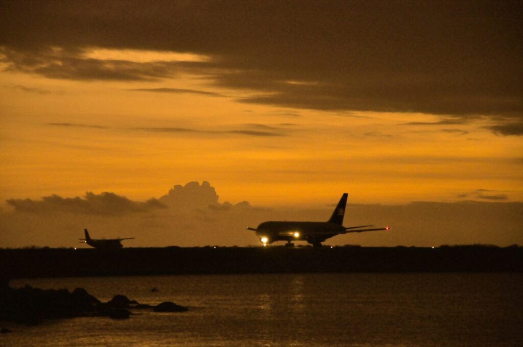 Private jets lined up for takeoff at sunset